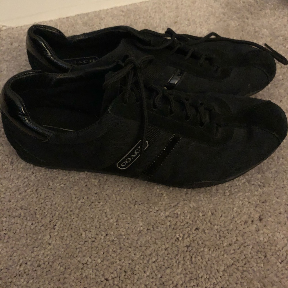 Black on black coach sneakers.